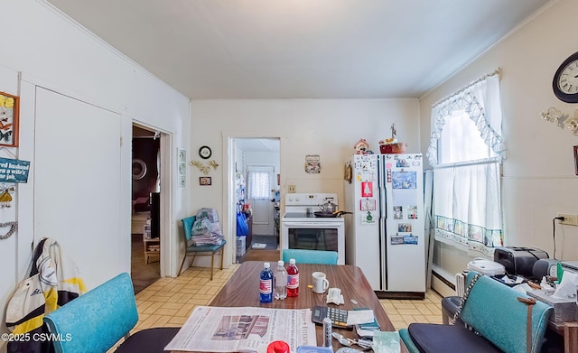 kitchen with white appliances and ornamental molding