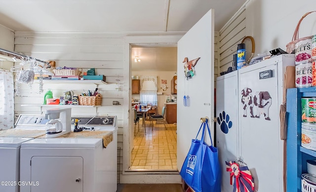 clothes washing area with washer and dryer