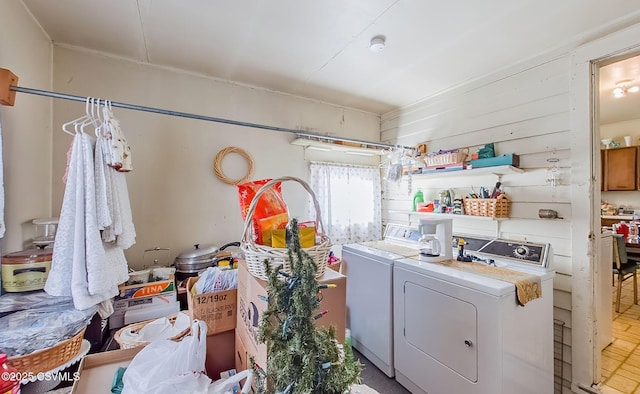 clothes washing area featuring washer and clothes dryer