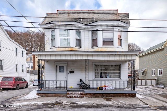 front facade featuring covered porch