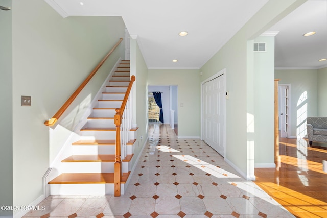 foyer entrance with crown molding