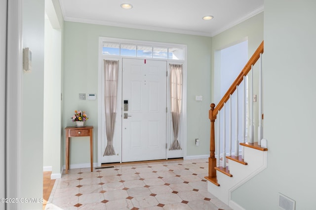 foyer entrance featuring ornamental molding