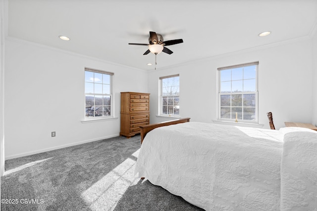 bedroom with ceiling fan, ornamental molding, and carpet floors