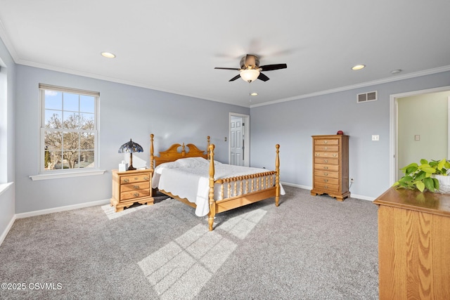 bedroom featuring ceiling fan, ornamental molding, and carpet floors