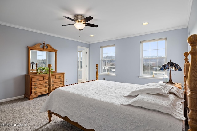 carpeted bedroom with ornamental molding and ceiling fan