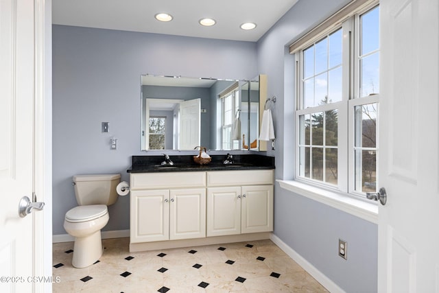 bathroom with vanity and toilet