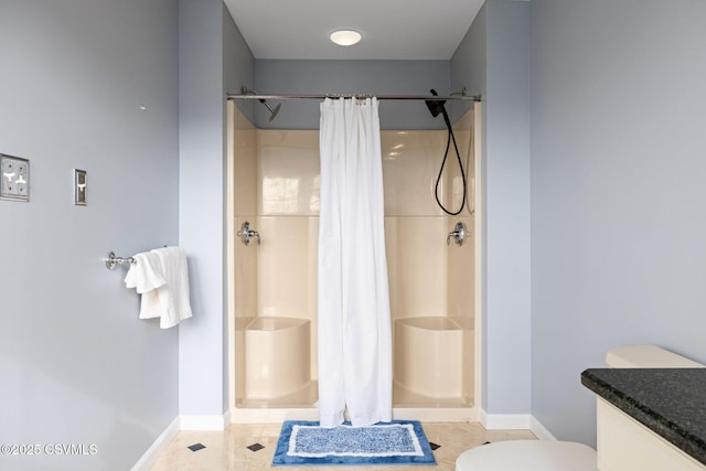 bathroom with a shower with curtain, toilet, and tile patterned flooring