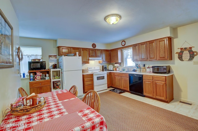 kitchen featuring sink and black appliances