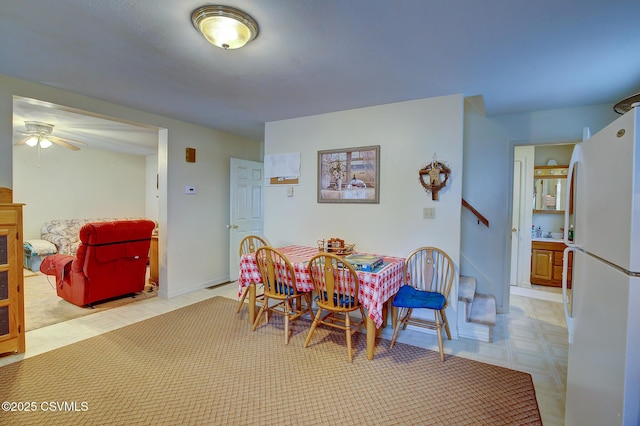 dining room featuring ceiling fan