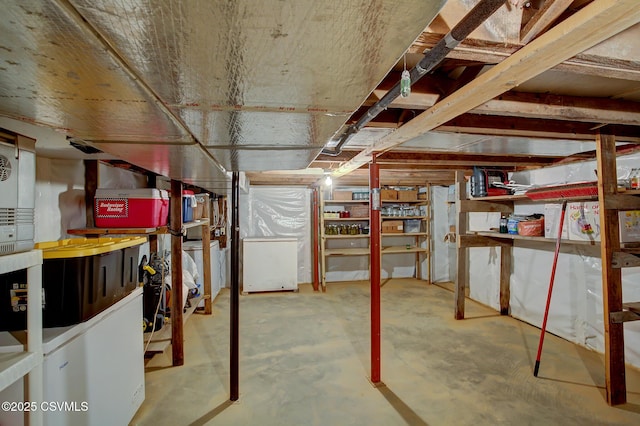 basement with fridge