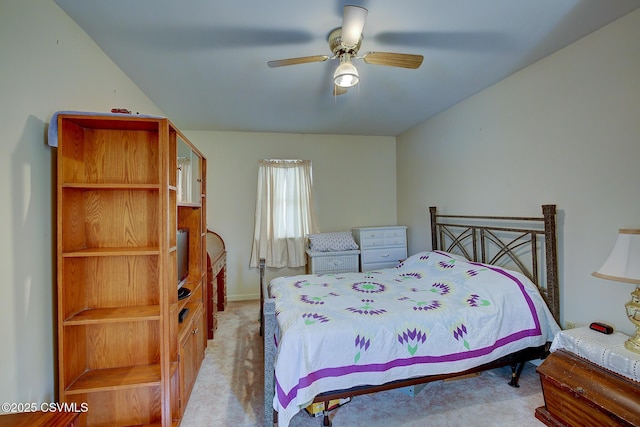 bedroom with light carpet and ceiling fan