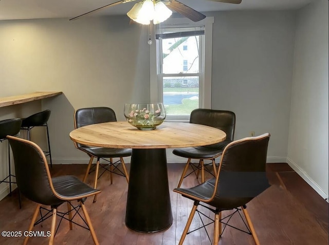 dining area featuring hardwood / wood-style flooring and ceiling fan