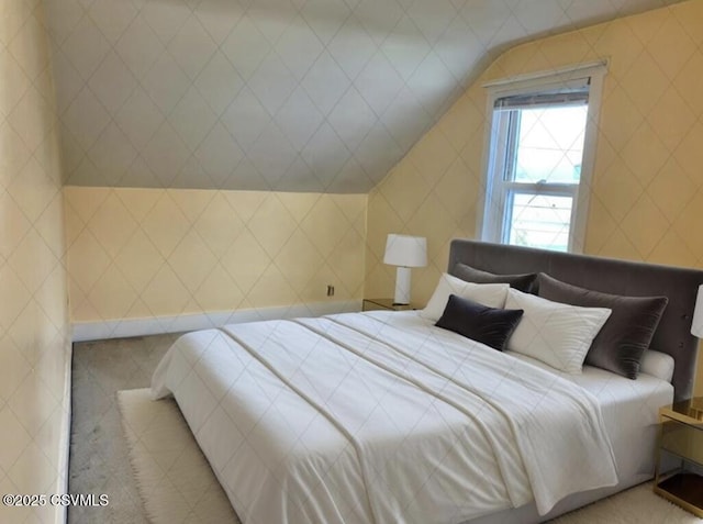 bedroom featuring vaulted ceiling