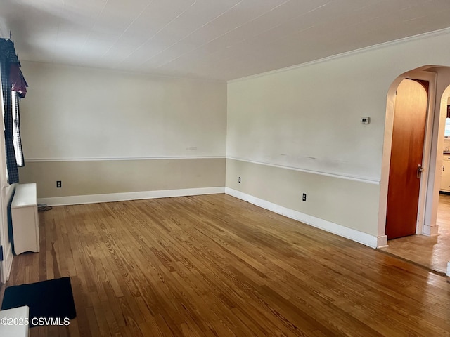 spare room with wood-type flooring