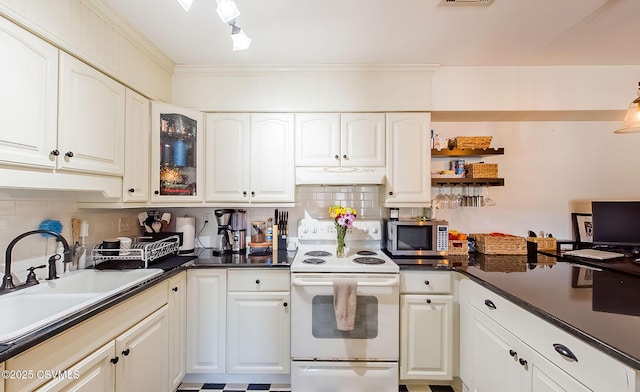 kitchen with white electric range oven, sink, white cabinetry, ornamental molding, and backsplash