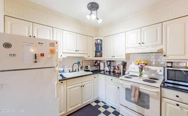 kitchen with crown molding, white appliances, sink, and decorative backsplash