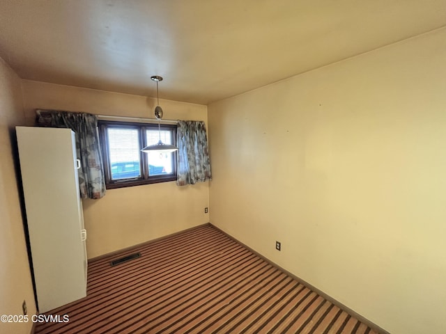 unfurnished room with carpet