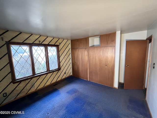 interior space with dark colored carpet