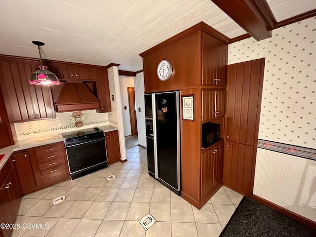 kitchen with custom exhaust hood, decorative light fixtures, light tile patterned floors, radiator, and black appliances