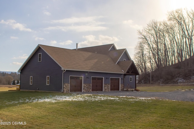 view of property exterior with a garage and a yard