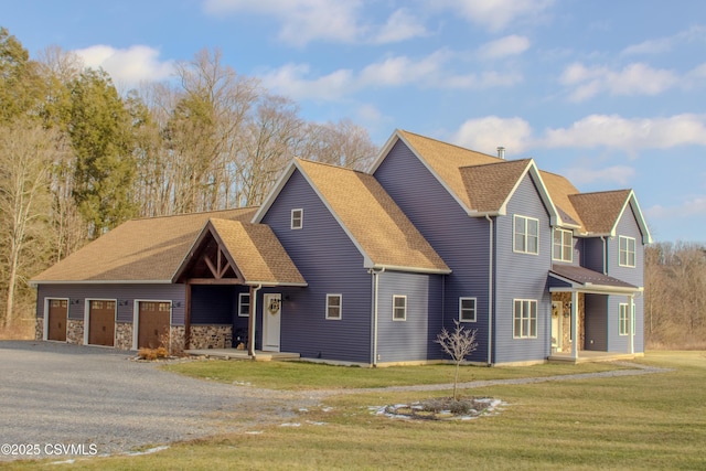 view of front facade with a garage and a front lawn