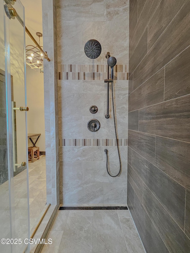 bathroom with a tile shower