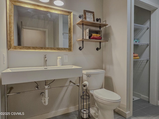 bathroom with sink and toilet