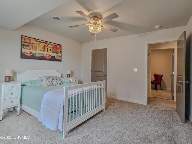 bedroom featuring ceiling fan and light colored carpet