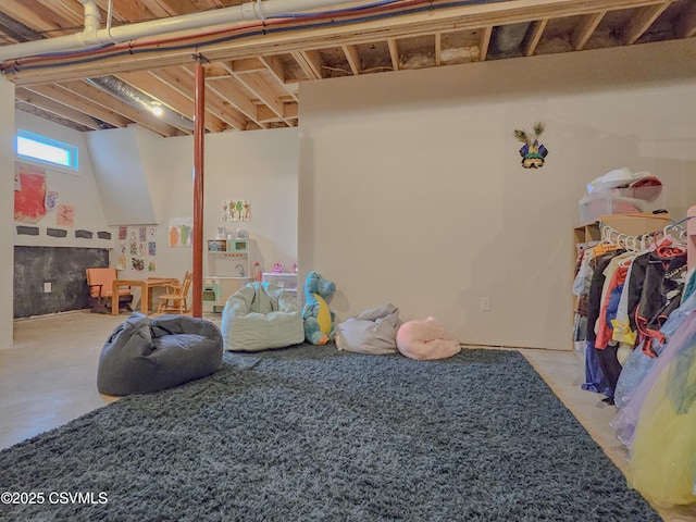 recreation room with concrete floors