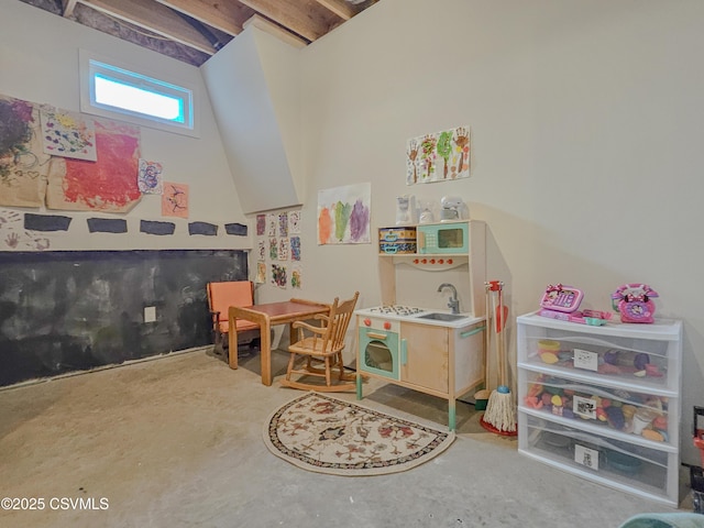 recreation room with concrete flooring and sink