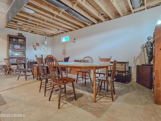 dining space with concrete flooring