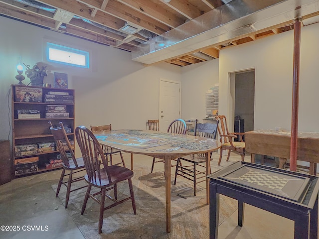 dining area featuring concrete flooring