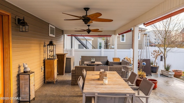 view of patio featuring ceiling fan