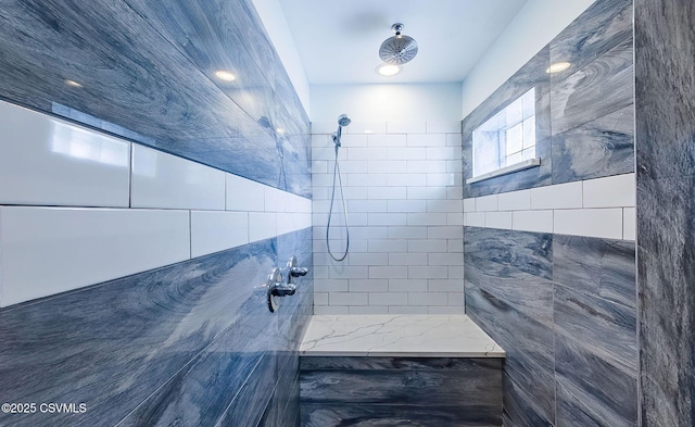 bathroom featuring a tile shower