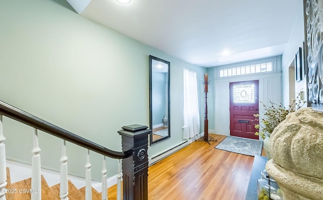 foyer with hardwood / wood-style flooring and baseboard heating