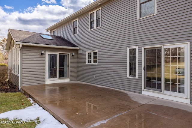 rear view of house featuring a patio