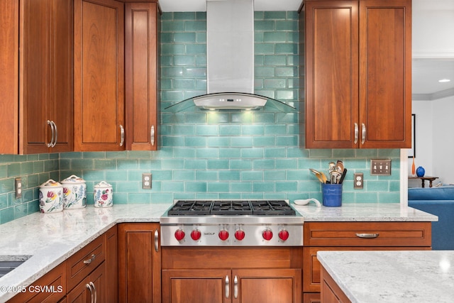 kitchen featuring wall chimney exhaust hood, light stone countertops, stainless steel gas cooktop, and backsplash