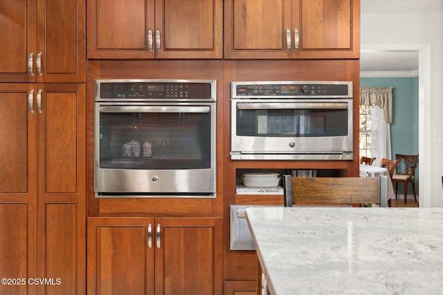 kitchen featuring light stone counters