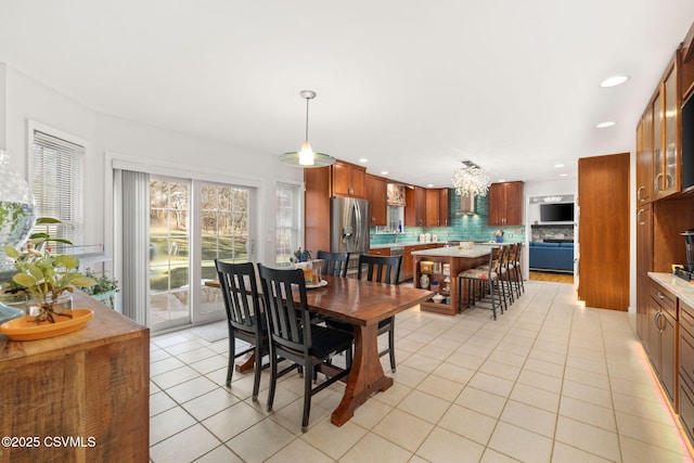 dining space featuring light tile patterned flooring