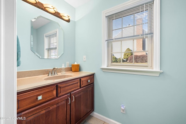 bathroom with tile patterned floors and vanity