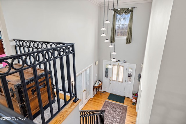 entryway featuring hardwood / wood-style flooring and a high ceiling