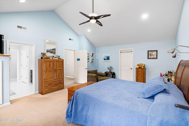 carpeted bedroom with high vaulted ceiling and ceiling fan