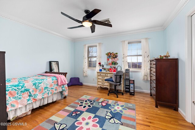 bedroom featuring ceiling fan, ornamental molding, light hardwood / wood-style floors, and multiple windows