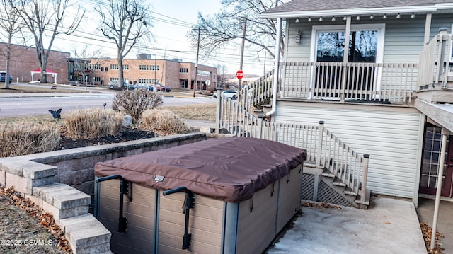 exterior space with a hot tub