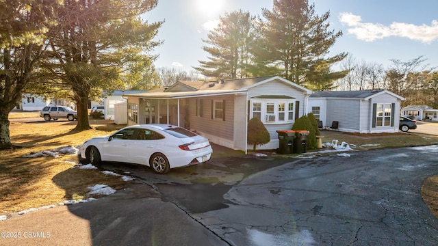 ranch-style house featuring a carport