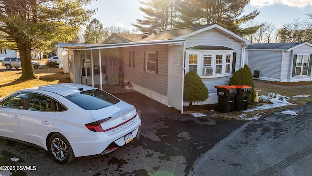 view of home's exterior featuring a carport