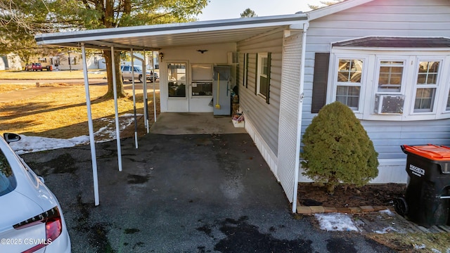 view of patio with a carport and cooling unit