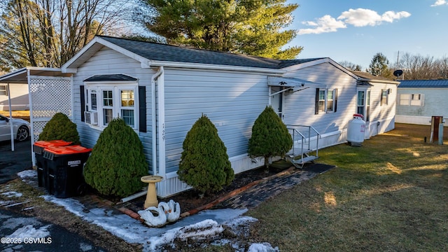 view of home's exterior featuring a yard