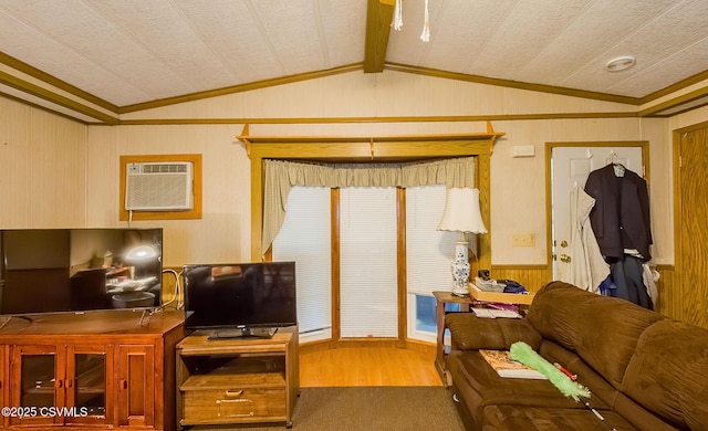 living room featuring lofted ceiling, hardwood / wood-style floors, a wall unit AC, and wood walls