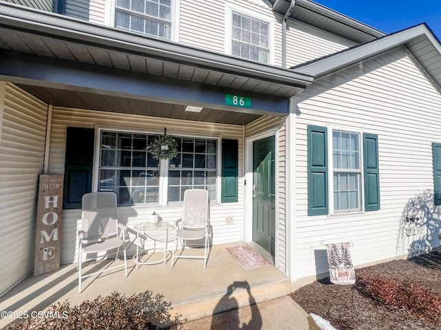 property entrance with covered porch